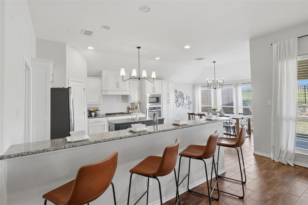 7224 Prestwick Terrace Benbrook, TX 76126 - Photo 10 of 26 a large kitchen with a table and chairs