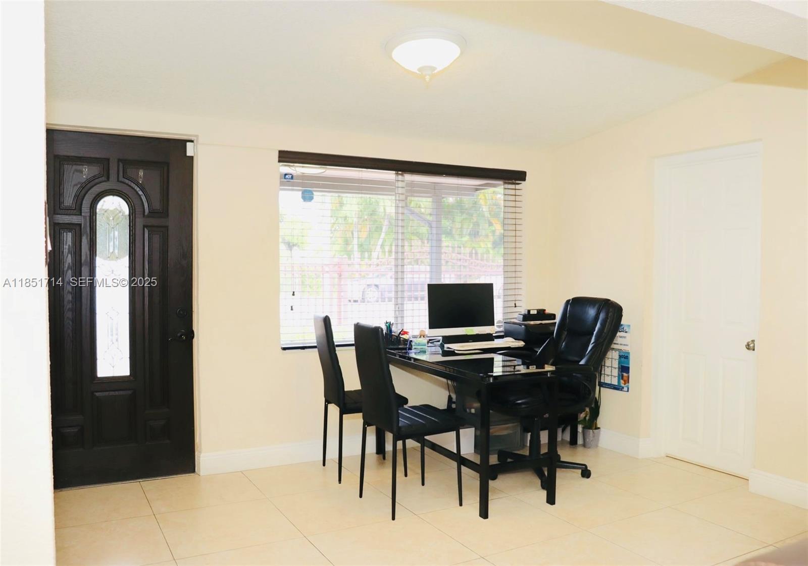 1847 West 2nd Avenue Hialeah, FL 33010 - Photo 11 of 27 a view of a workspace with furniture and a window