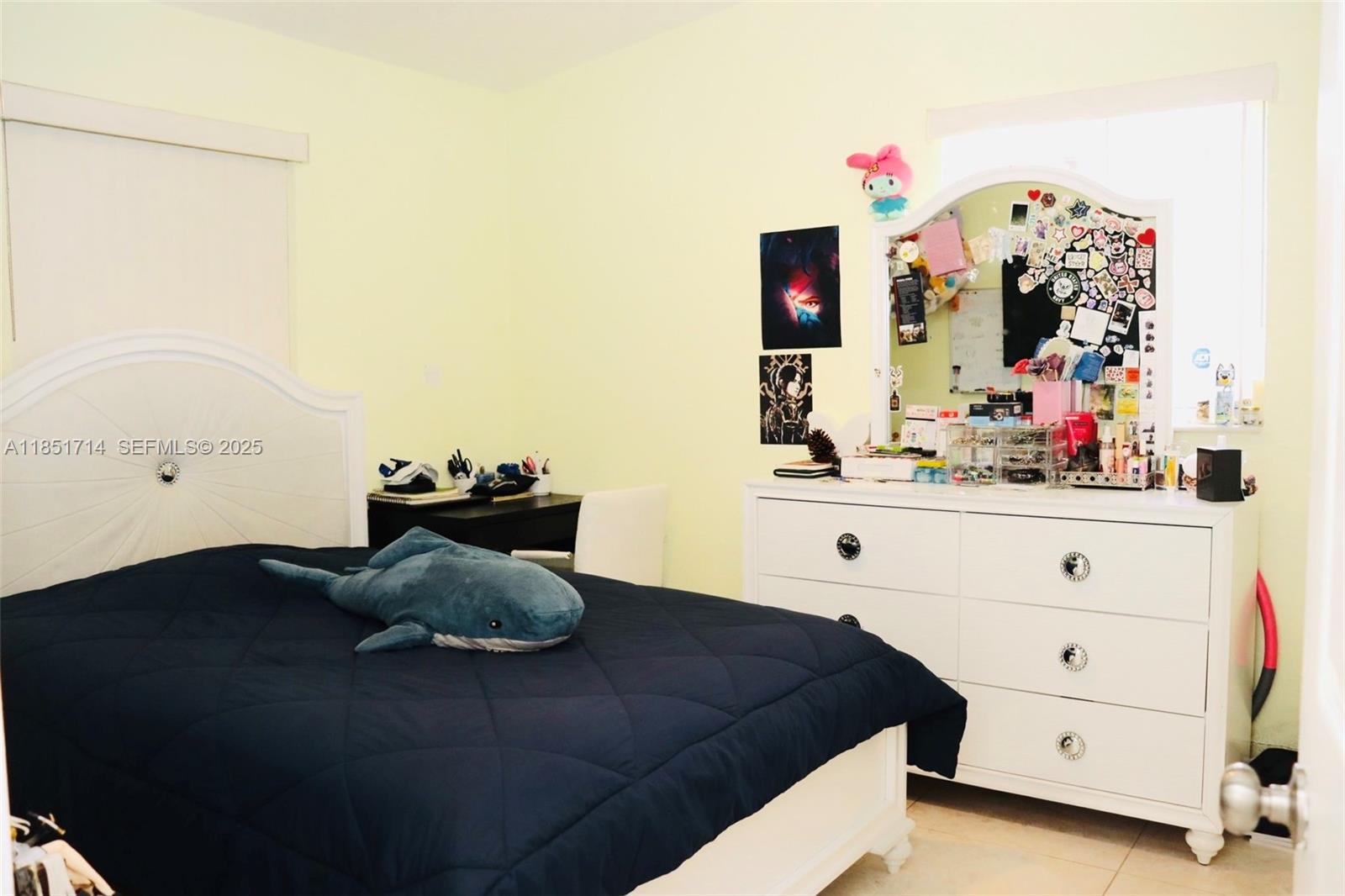 1847 West 2nd Avenue Hialeah, FL 33010 - Photo 15 of 27 a bedroom with a bed and a dresser