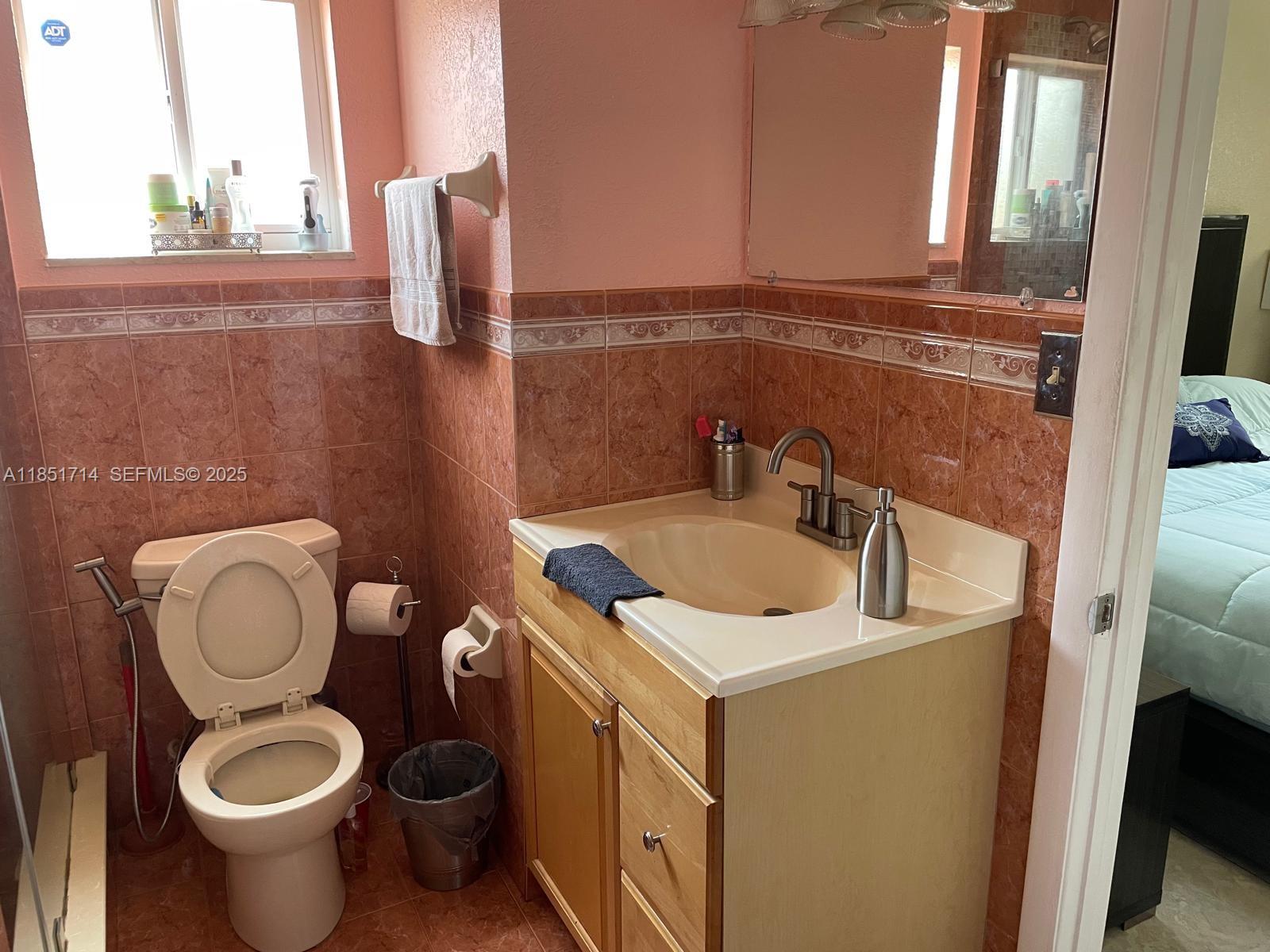 1847 West 2nd Avenue Hialeah, FL 33010 - Photo 18 of 27 a bathroom with a sink and a toilet