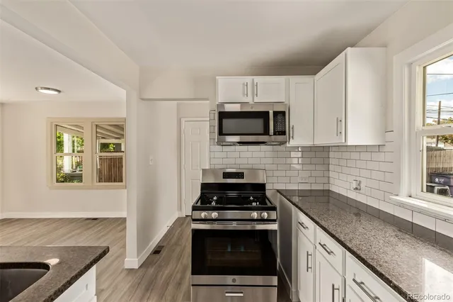 a kitchen with a stove and a sink