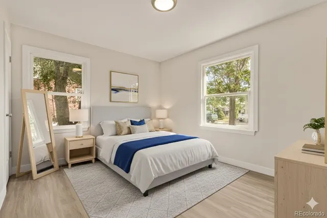 a bed room with a bed and a window