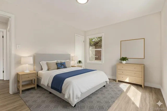 a bedroom with a bed and a dresser