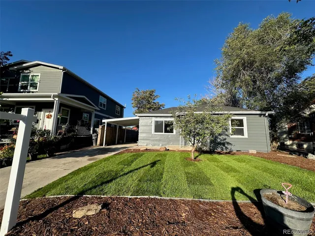 front view of a house with a yard