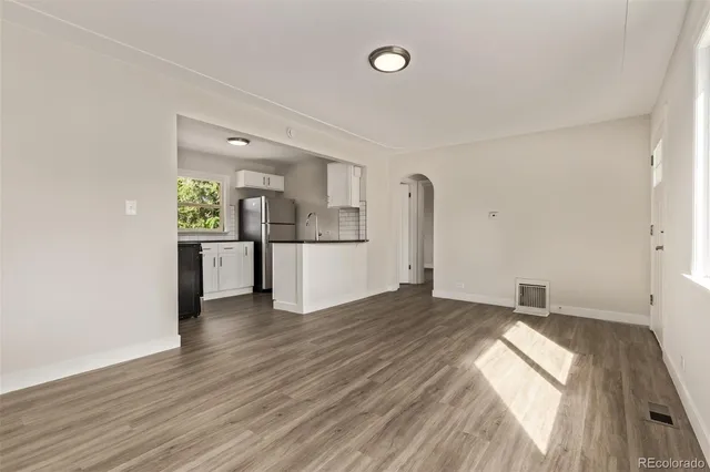 a view of a kitchen with a sink and a stove
