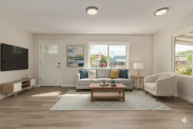 a living room with furniture or couch and a flat screen tv