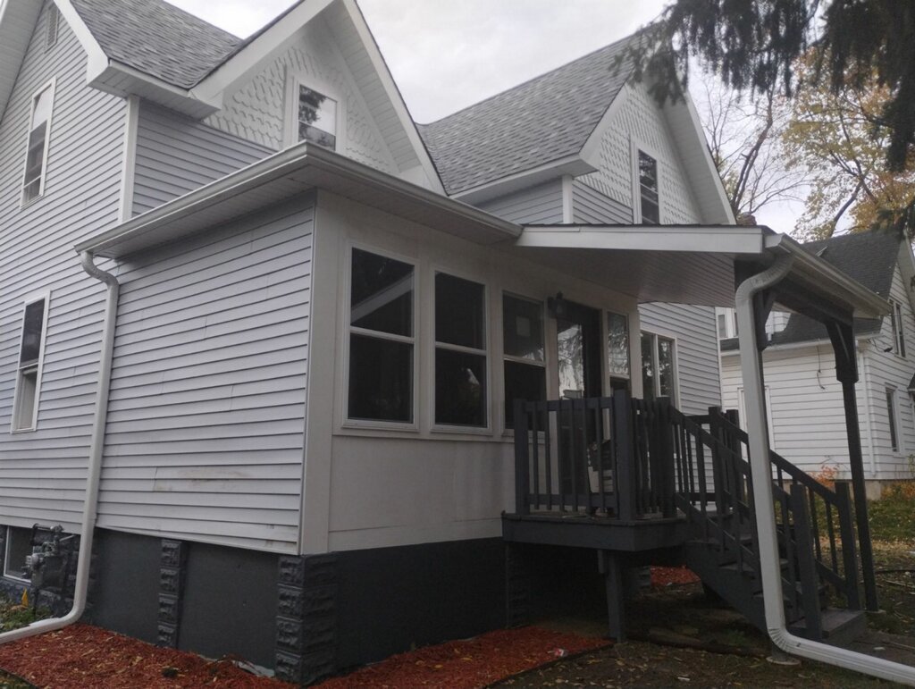 144 Harrison Street DeKalb, IL 60115 - Photo 2 of 12 a view of a house with a door and wooden floor