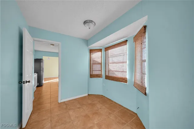 view of an empty room with a window