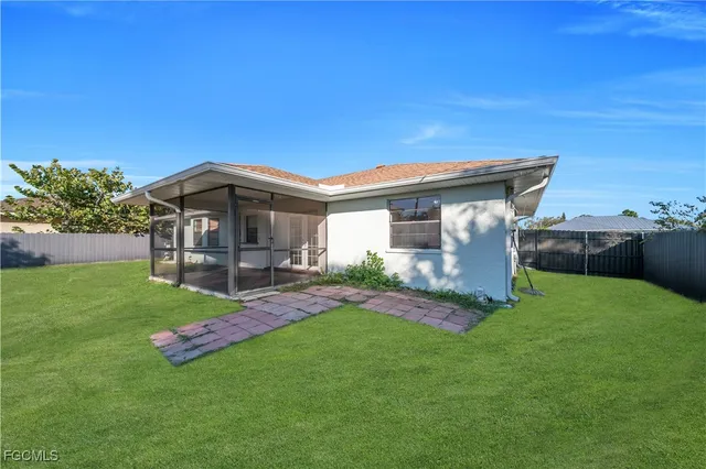 a view of a house with a yard porch and sitting area