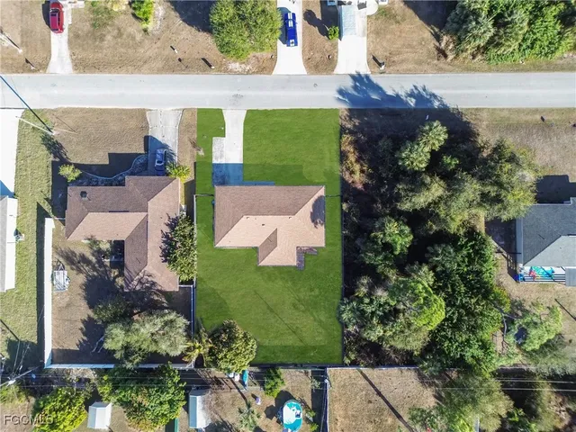 an aerial view of house with a yard