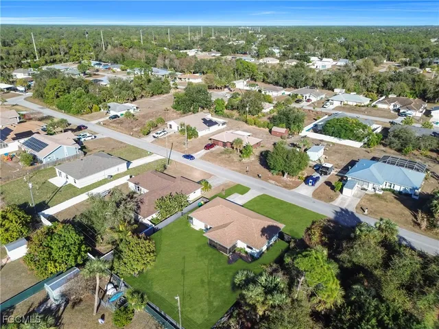 an aerial view of residential houses with outdoor space