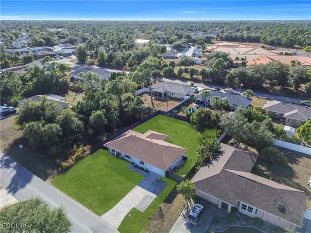 an aerial view of a house with a garden