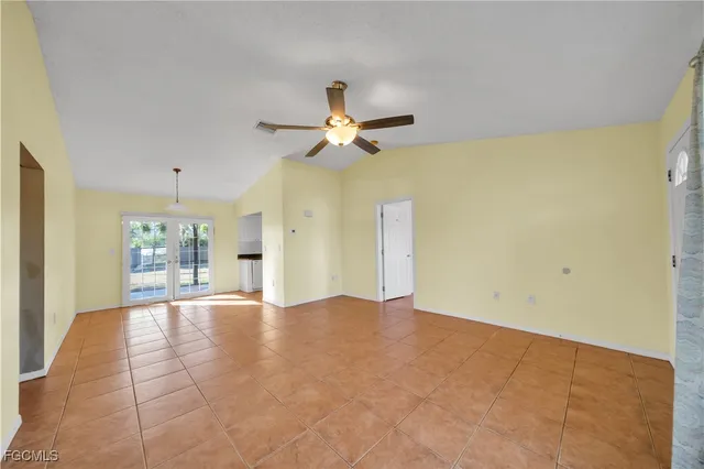 a view of a kitchen with a sink furniture and a chandelier