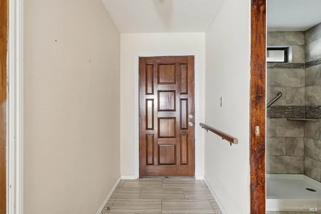 a view of a hallway with a wooden floor