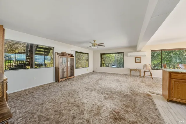 a kitchen with granite countertop stainless steel appliances a refrigerator sink and cabinets