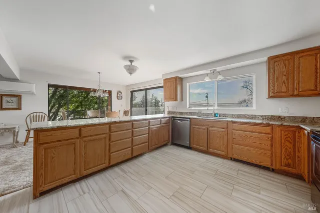 a view of an empty room with a ceiling fan