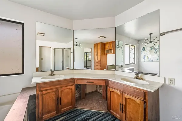 a room with pool table and windows