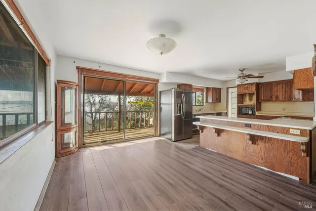a kitchen with stainless steel appliances granite countertop a sink and cabinets