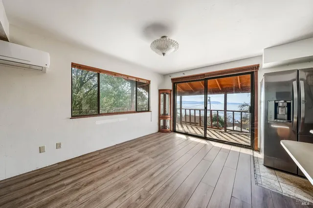 a view of empty room with wooden ceiling