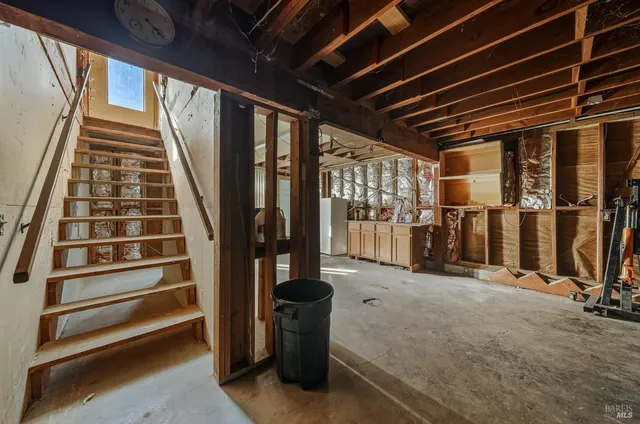 an aerial view of a house with a yard and lake view