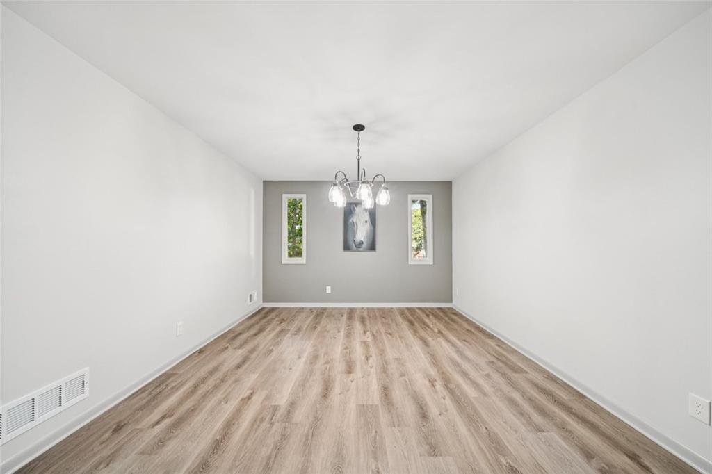 230 Lakeview Ridge East Roswell, GA 30076 - Photo 14 of 70 wooden floor in a hall with an empty room