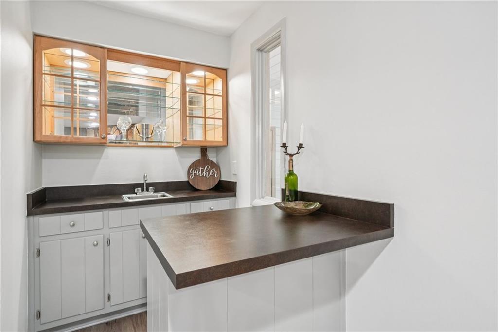 230 Lakeview Ridge East Roswell, GA 30076 - Photo 21 of 70 a kitchen with a sink a stove and cabinets