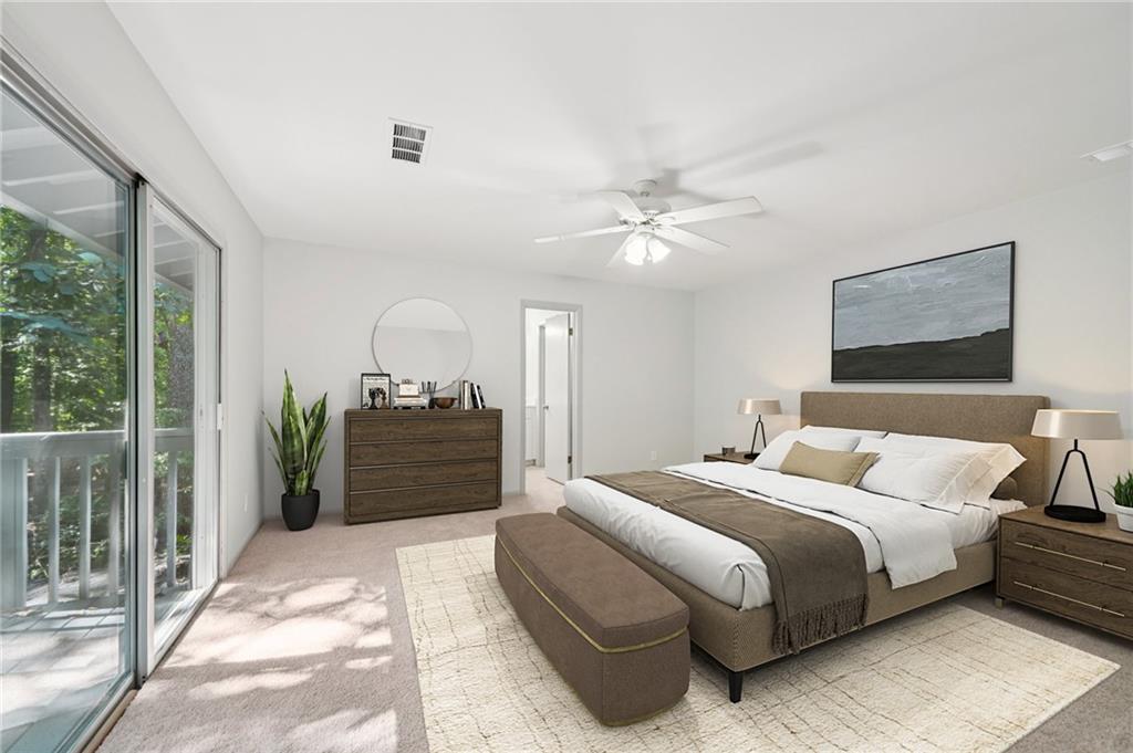 230 Lakeview Ridge East Roswell, GA 30076 - Photo 23 of 70 a bedroom with a large bed and a chandelier