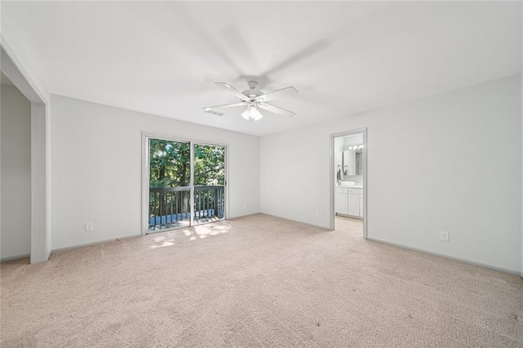 230 Lakeview Ridge East Roswell, GA 30076 - Photo 24 of 70 an empty room with windows and ceiling fan