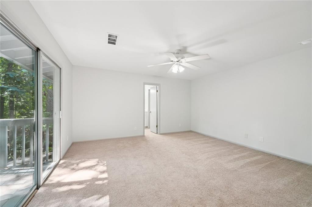 230 Lakeview Ridge East Roswell, GA 30076 - Photo 25 of 70 an empty room with windows and fan
