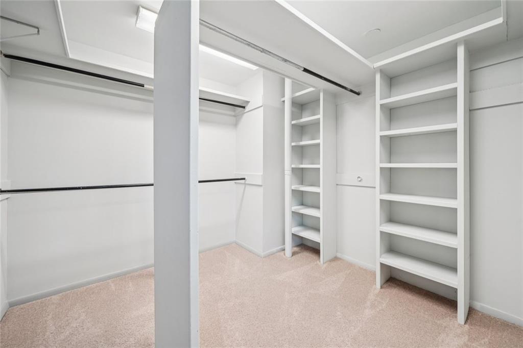 230 Lakeview Ridge East Roswell, GA 30076 - Photo 27 of 70 a view of walk in closet with empty racks