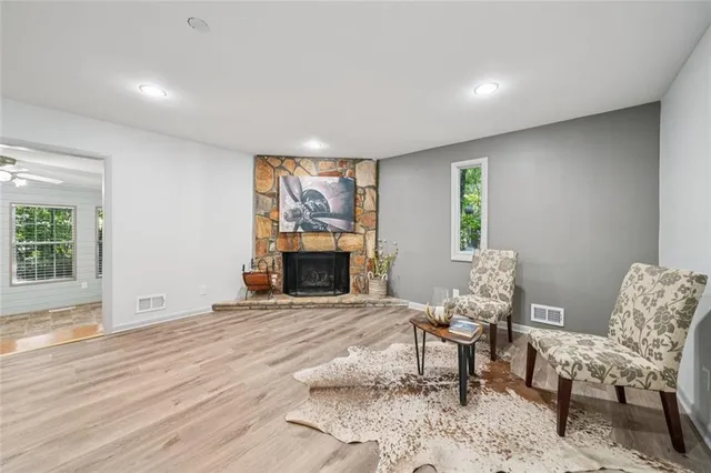 a front view of house with yard and trees