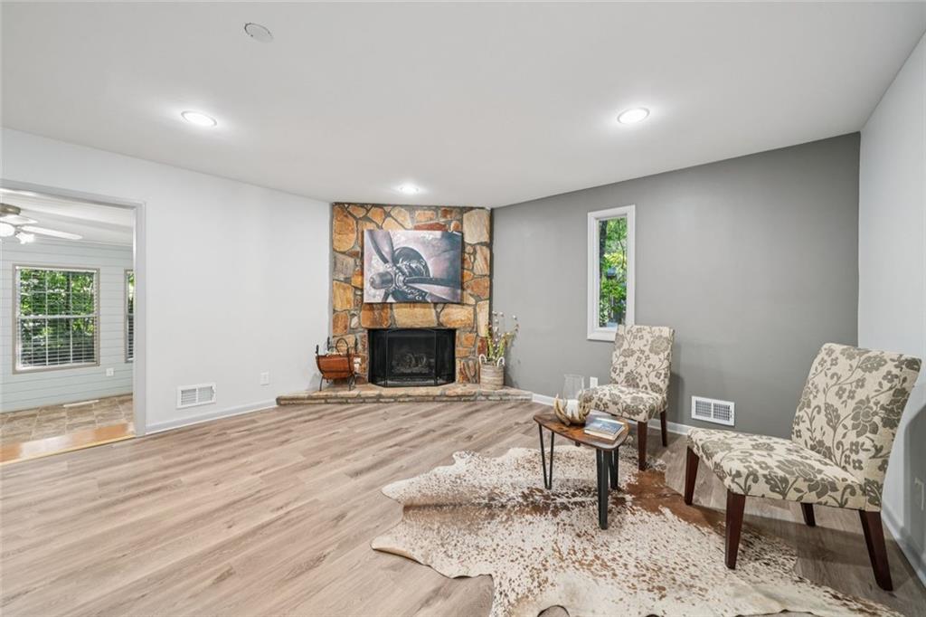 230 Lakeview Ridge East Roswell, GA 30076 - Photo 4 of 70 a living room with furniture and a fireplace