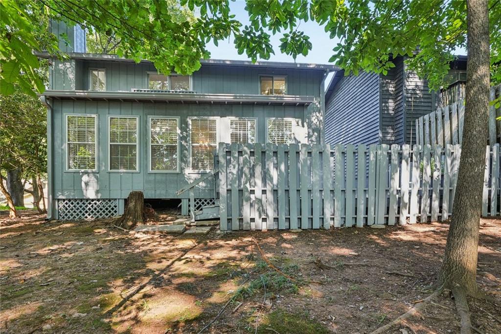 230 Lakeview Ridge East Roswell, GA 30076 - Photo 46 of 70 a view of a house with a yard and wooden fence