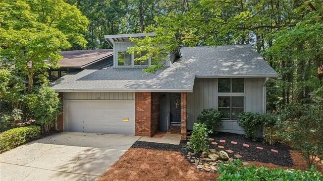 a kitchen with cabinets and wooden floor