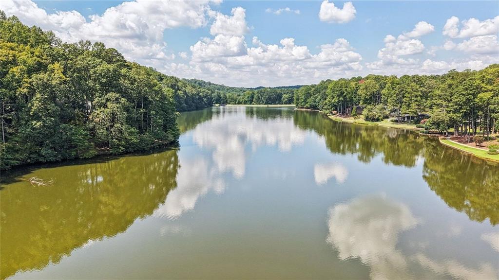 230 Lakeview Ridge East Roswell, GA 30076 - Photo 63 of 70 a view of a lake with a building in the background