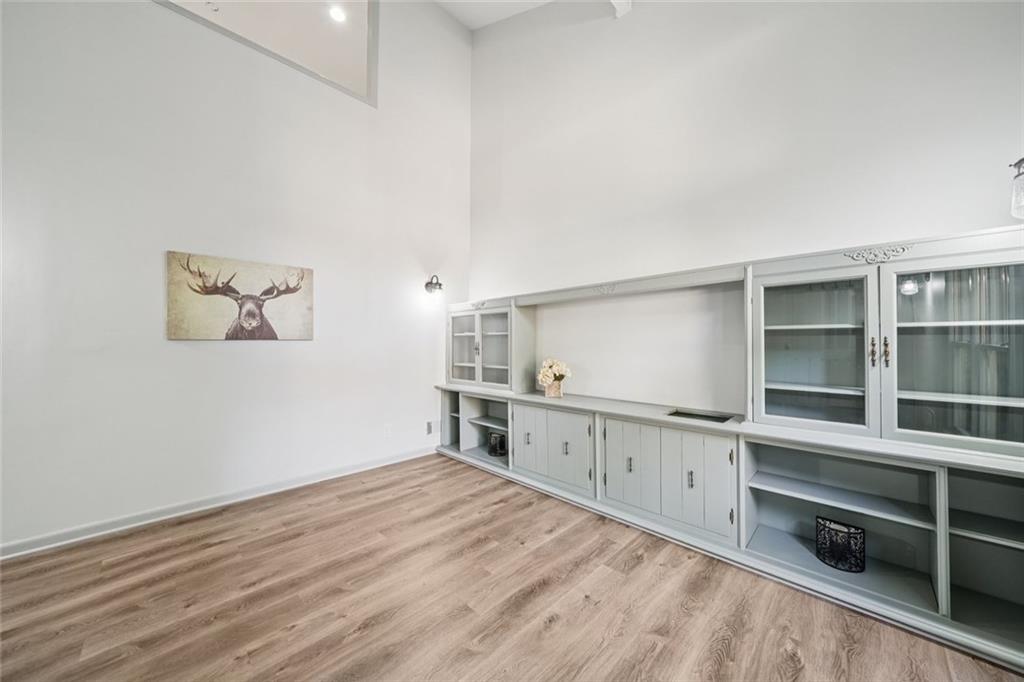 230 Lakeview Ridge East Roswell, GA 30076 - Photo 7 of 70 a kitchen with cabinets and wooden floor