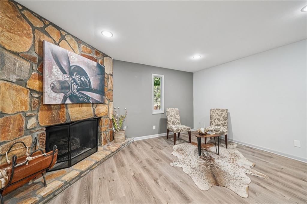 230 Lakeview Ridge East Roswell, GA 30076 - Photo 10 of 70 a living room with furniture and a fireplace