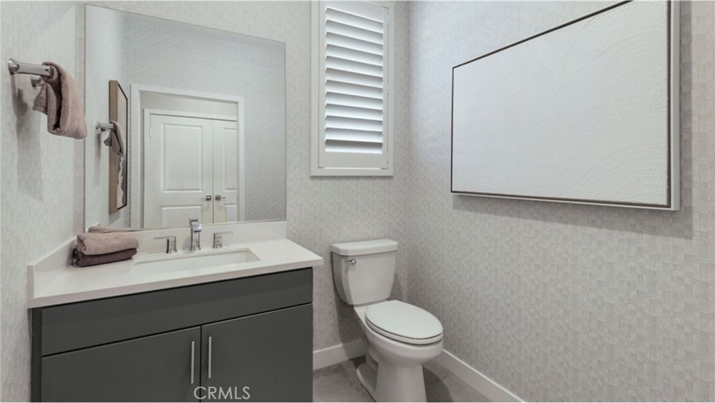 2109 Crescent Moon Upland, CA 91786 - Photo 13 of 17 a bathroom with a sink a toilet and mirror