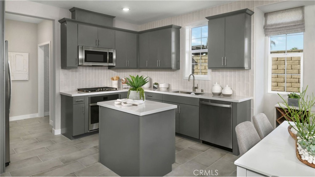 2109 Crescent Moon Upland, CA 91786 - Photo 4 of 17 a kitchen with a sink stove and microwave