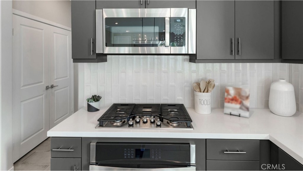 2109 Crescent Moon Upland, CA 91786 - Photo 5 of 17 a kitchen with a stove and a microwave