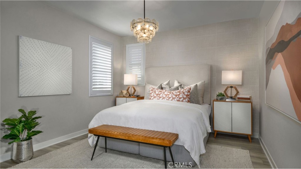 2109 Crescent Moon Upland, CA 91786 - Photo 7 of 17 a bedroom with a bed and a chandelier