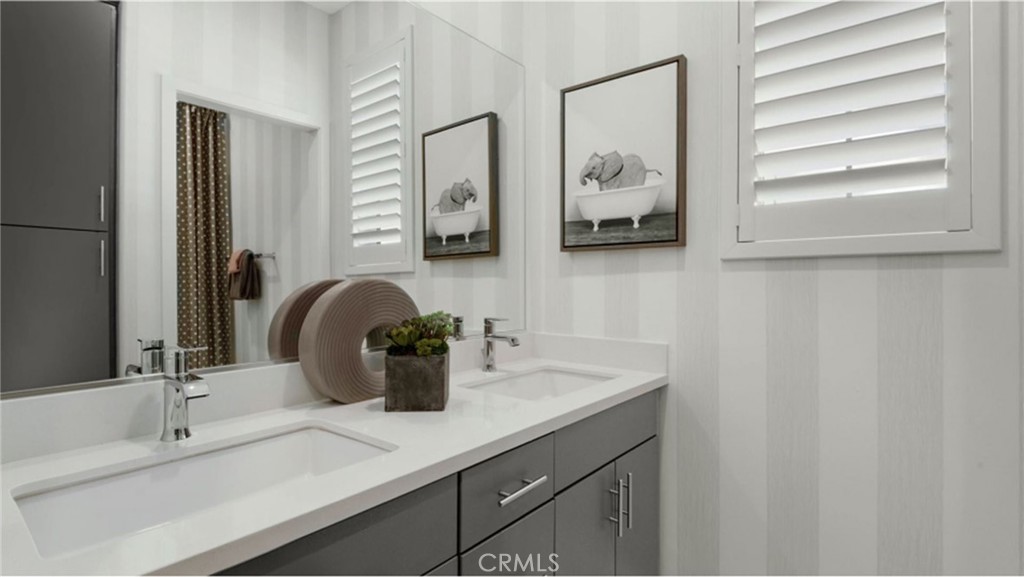 2109 Crescent Moon Upland, CA 91786 - Photo 9 of 17 a bathroom with a double vanity sink and a mirror