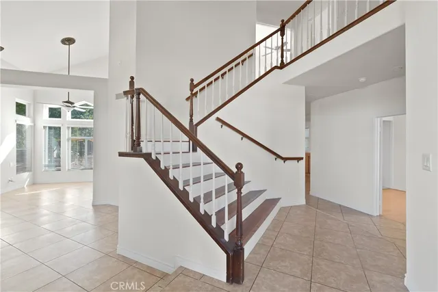 a kitchen with kitchen island granite countertop a sink stove and refrigerator