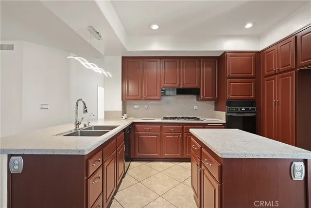 a large white kitchen with a white cabinet and a stove top oven