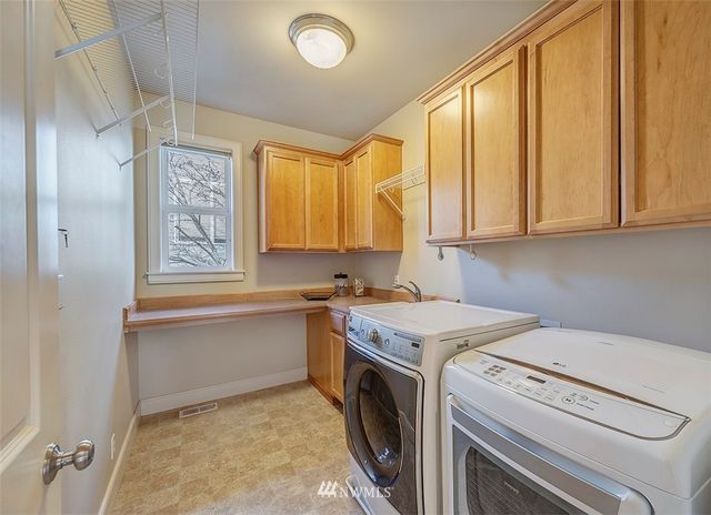 a view of a kitchen with electric appliances