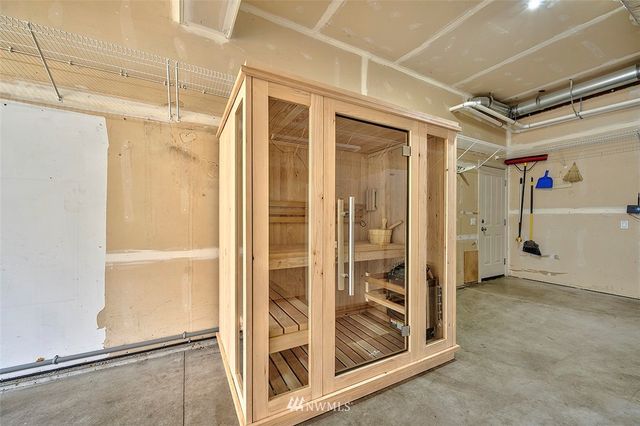 a living room with lots of furniture and kitchen view