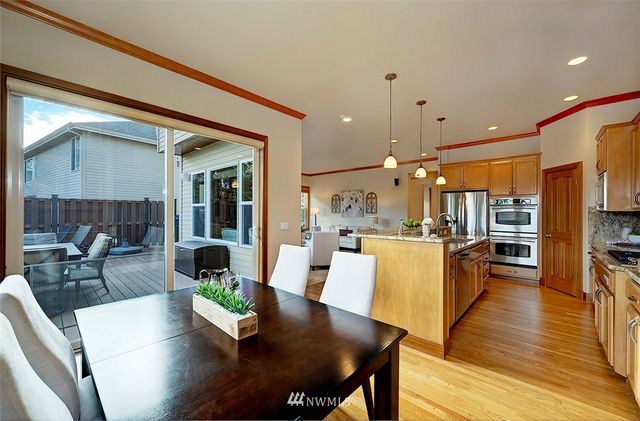 a view of a chair and table on the wooden floor