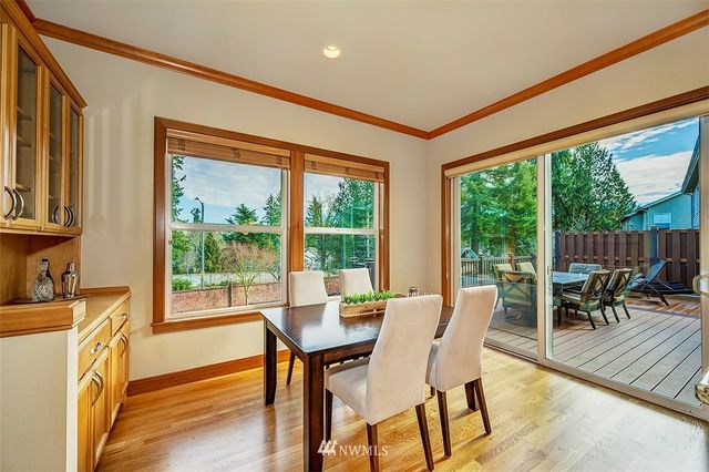 a view of a dining room with furniture window and outside view