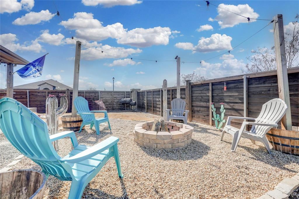 830 Rustic Way Josephine, TX 75189 - Photo 24 of 33 Fenced backyard with an outdoor fire pit