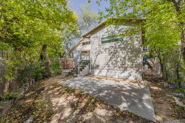 a backyard of a house with lots of green space